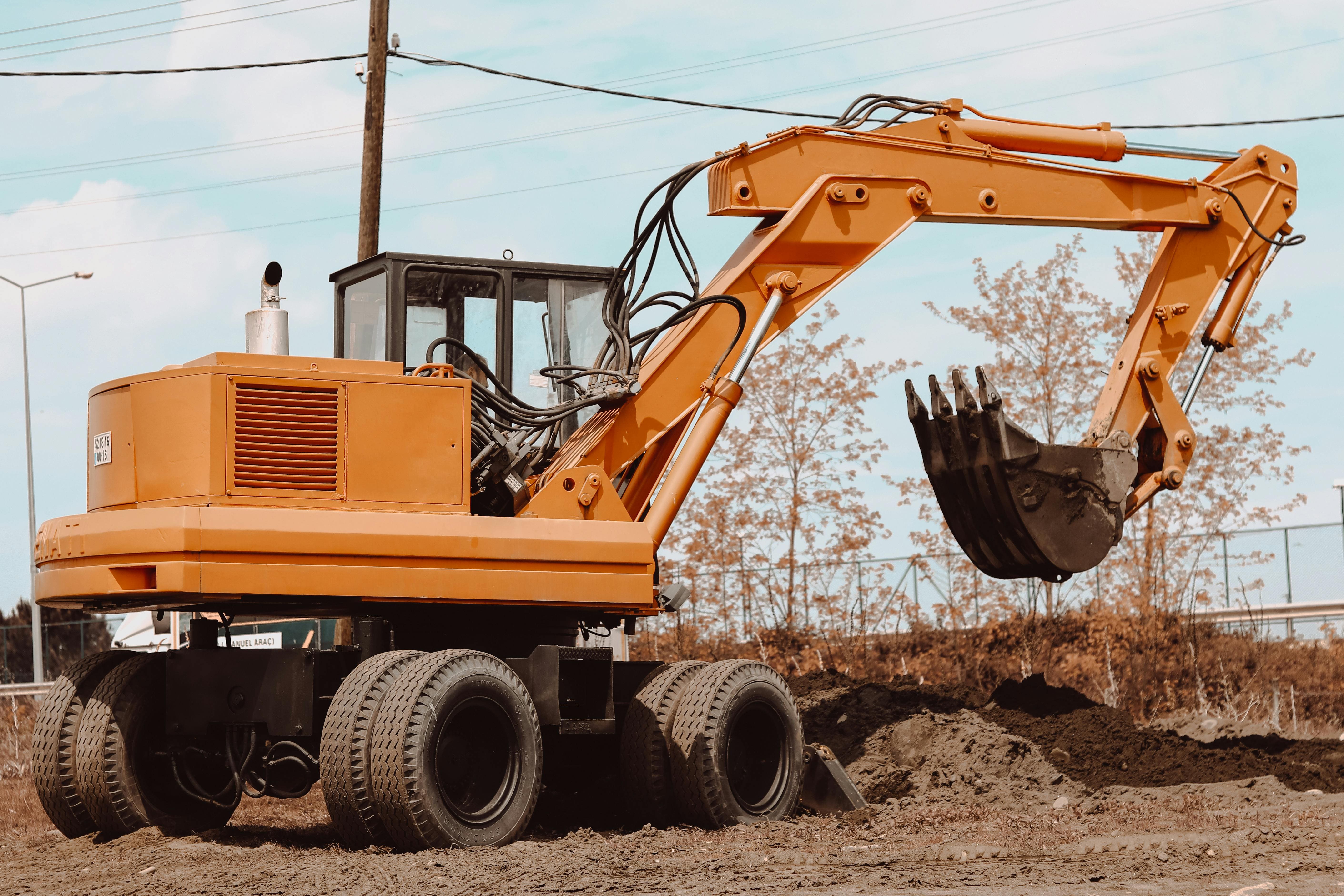 Mini-excavator digging trench